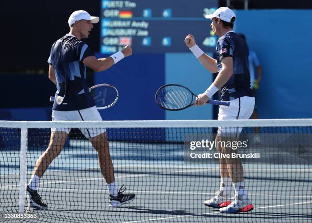 Andy Murray of Team Great Britain and Joe Salisbury of Team Great Britain celebrate after a point during their Men's Doubles Second Round match...