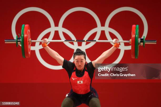 Mikiko Andoh of Team Japan competes during the Weightlifting - Women's 59kg Group A on day four of the Tokyo 2020 Olympic Games at Tokyo...