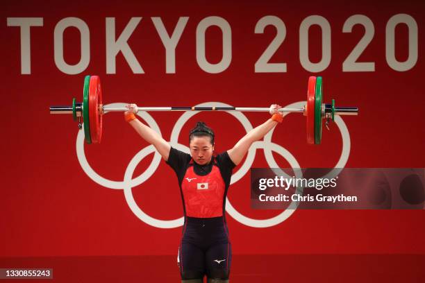 Mikiko Andoh of Team Japan competes during the Weightlifting - Women's 59kg Group A on day four of the Tokyo 2020 Olympic Games at Tokyo...