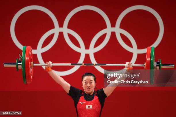 Mikiko Andoh of Team Japan competes during the Weightlifting - Women's 59kg Group A on day four of the Tokyo 2020 Olympic Games at Tokyo...