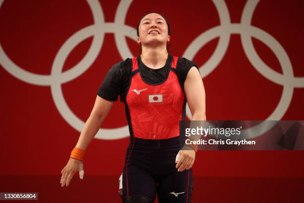 Mikiko Andoh of Team Japan competes during the Weightlifting - Women’s 59kg Group A on day four of the Tokyo 2020 Olympic Games at Tokyo...
