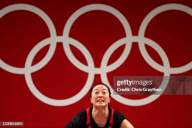 Mikiko Andoh of Team Japan competes during the Weightlifting - Women’s 59kg Group A on day four of the Tokyo 2020 Olympic Games at Tokyo...