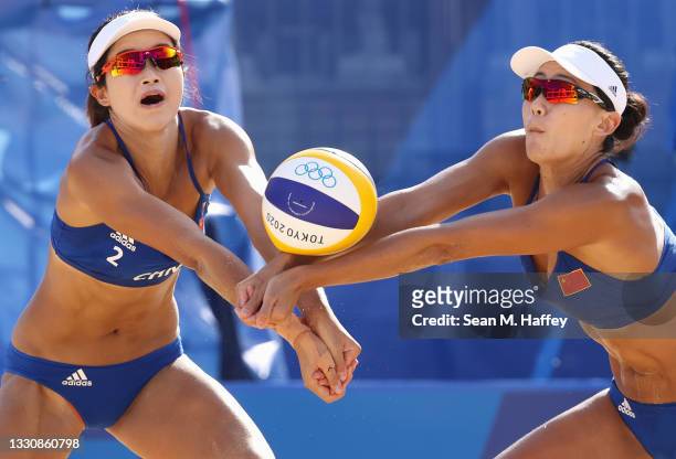Chen Xue and Xinxin Wang of Team China compete against Team Netherlands during the Women's Preliminary - Pool B beach volleyball on day four of the...
