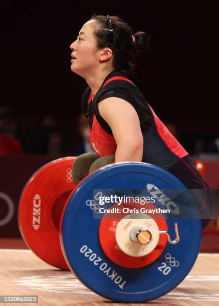 Mikiko Andoh of Team Japan competes during the Weightlifting - Women's 59kg Group A on day four of the Tokyo 2020 Olympic Games at Tokyo...