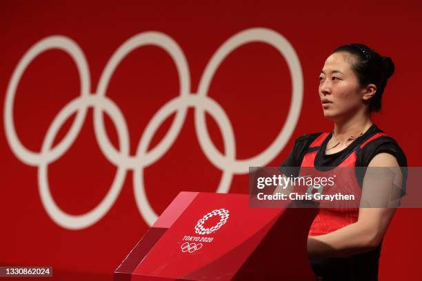 Mikiko Andoh of Team Japan competes during the Weightlifting - Women's 59kg Group A on day four of the Tokyo 2020 Olympic Games at Tokyo...