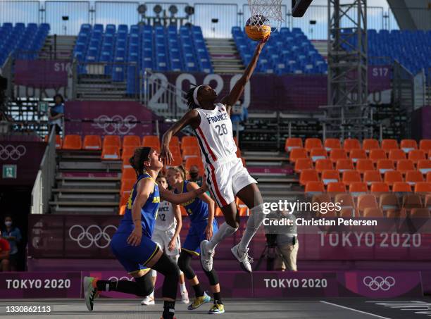 Mamignan Toure of Team France drives to the basket in the 3x3 Basketball competition on day four of the Tokyo 2020 Olympic Games at Aomi Urban Sports...