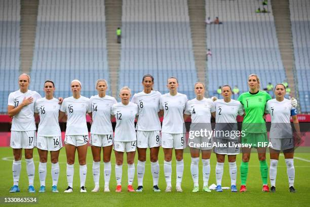 Players of Team New Zealand stand for the national anthem prior to the Women's Group G match between New Zealand and Sweden on day four of the Tokyo...