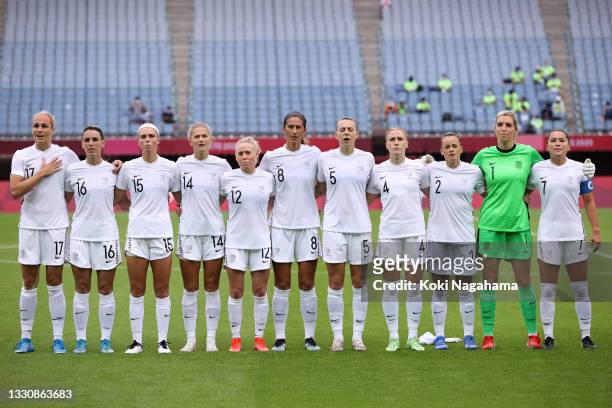 Players of Team New Zealand stand for the national anthem prior to the Women's Group G match between New Zealand and Sweden on day four of the Tokyo...