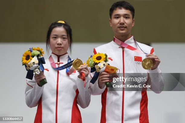 Gold Medalists Qian Yang and Haoran Yang of Team China pose on the podium during the medal ceremony of the 10m Air Rifle Mixed Team event on day four...
