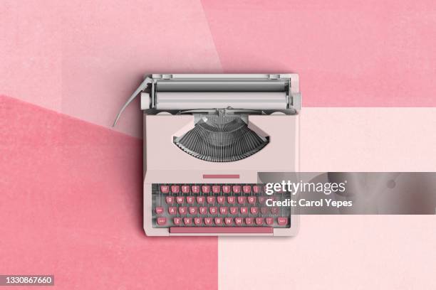 top view of a typewriter from the 70s , isolated on pink background. - typewriter stock pictures, royalty-free photos & images