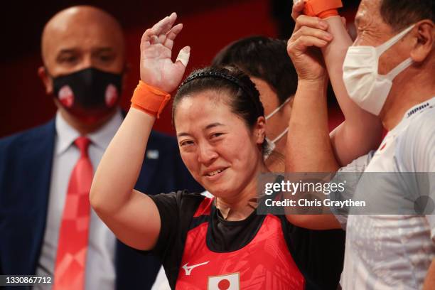 Mikiko Andoh of Team Japan competes during the Weightlifting - Women's 59kg Group A on day four of the Tokyo 2020 Olympic Games at Tokyo...