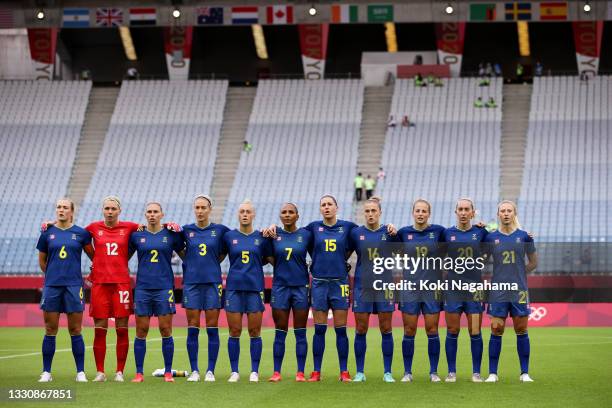 Players of Team Sweden stand for the national anthem prior to the Women's Group G match between New Zealand and Sweden on day four of the Tokyo 2020...