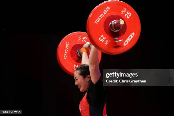 Mikiko Andoh of Team Japan competes during the Weightlifting - Women's 59kg Group A on day four of the Tokyo 2020 Olympic Games at Tokyo...