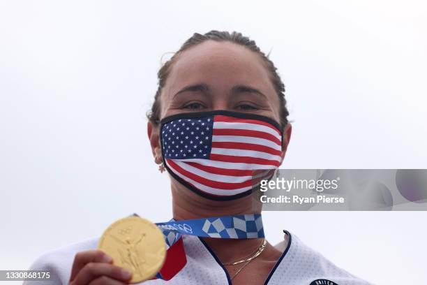 Surfing Gold Medalist Carissa Moore of Team United States shows her medal on day four of the Tokyo 2020 Olympic Games at Tsurigasaki Surfing Beach on...