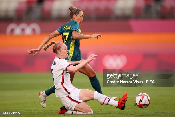 Becky Sauerbrunn of Team United States battles for possession with Kyah Simon of Team Australia during the Women's Football Group G match between...