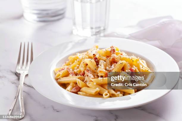 penne carbonara - penne stock pictures, royalty-free photos & images