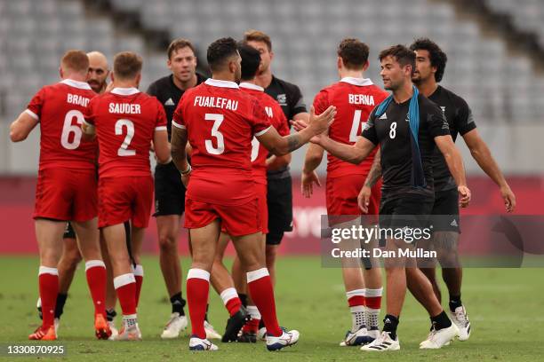 Players of New Zealand and Canada shake hands after the Rugby Sevens Men's Quarter-final match between New Zealand and Canada on day four of the...