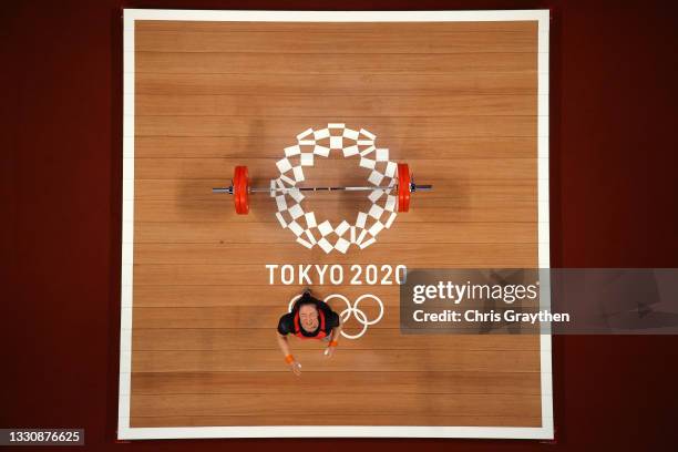 Mikiko Andoh of Team Japan competes during the Weightlifting - Women's 59kg Group A on day four of the Tokyo 2020 Olympic Games at Tokyo...