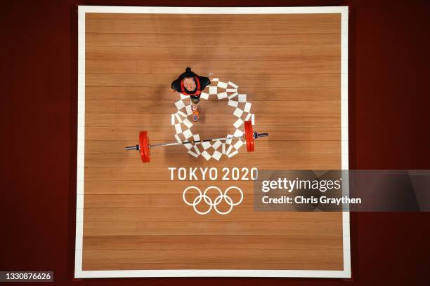 Mikiko Andoh of Team Japan competes during the Weightlifting - Women's 59kg Group A on day four of the Tokyo 2020 Olympic Games at Tokyo...