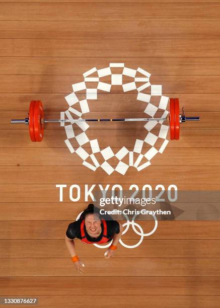 Mikiko Andoh of Team Japan competes during the Weightlifting - Women's 59kg Group A on day four of the Tokyo 2020 Olympic Games at Tokyo...