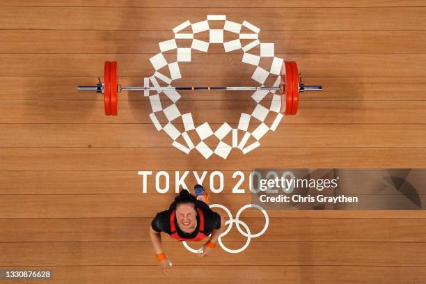 Mikiko Andoh of Team Japan competes during the Weightlifting - Women's 59kg Group A on day four of the Tokyo 2020 Olympic Games at Tokyo...