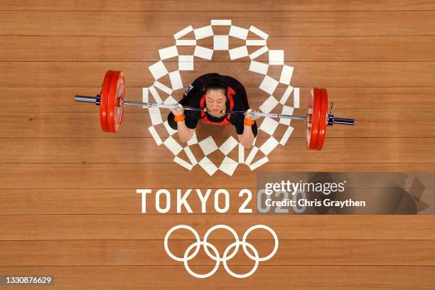 Mikiko Andoh of Team Japan competes during the Weightlifting - Women's 59kg Group A on day four of the Tokyo 2020 Olympic Games at Tokyo...