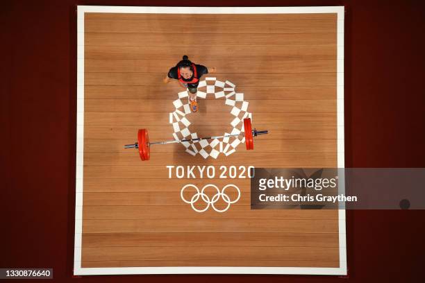 Mikiko Andoh of Team Japan competes during the Weightlifting - Women's 59kg Group A on day four of the Tokyo 2020 Olympic Games at Tokyo...