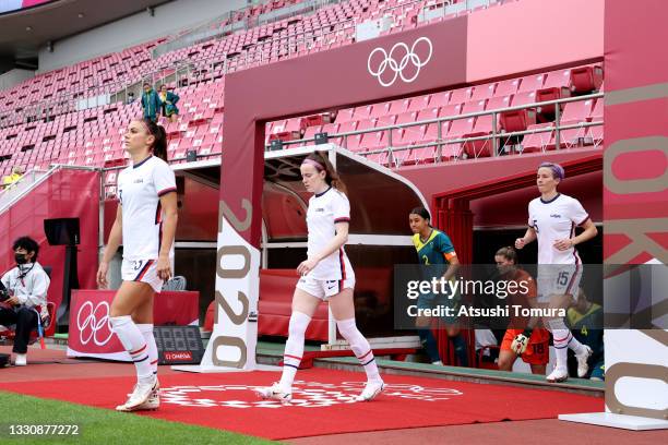 Alex Morgan, Rose Lavelle and Megan Rapinoe of Team United States take to the field prior to the Women's Football Group G match between United States...