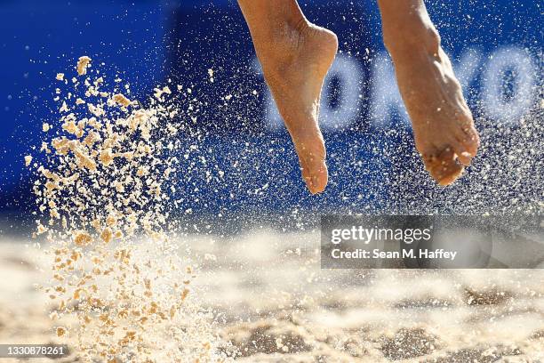 Madelein Meppelink of Team Netherlands leaps to spike a shot against Team China during the Women's Preliminary - Pool B beach volleyball on day four...