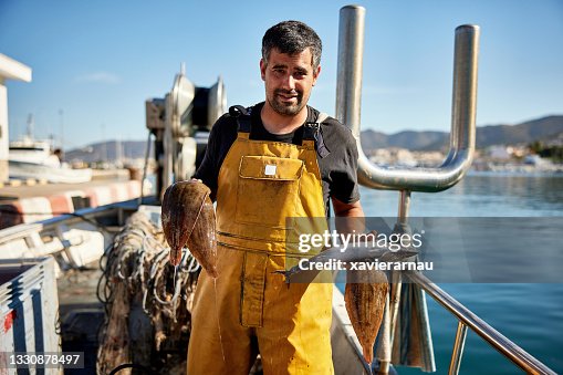 Portrait of Independent Fisherman Holding Fresh Catch Portrait of Independent Fisherman Holding Fresh Catch