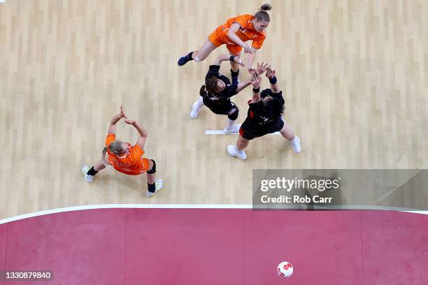 Nycke Groot of Team Netherlands shoots at goal as Sim Haein and Kang Eunhye of Team South Korea attempt to defend during the Woman's Preliminary...