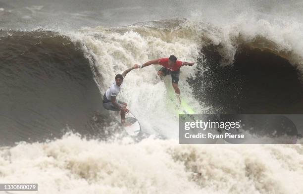 Gabriel Medina of Team Brazil pulls a priority blocking move on Michel Bourez of Team France during their men's Quarter Final on day four of the...