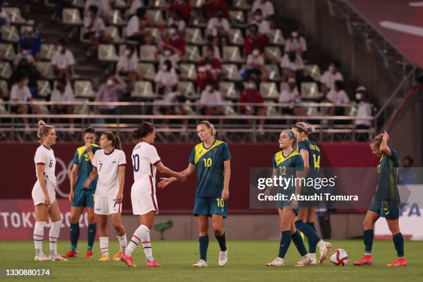 Carli Lloyd of Team United States shakes hands with Emily Van Egmond of Team Australia following the Women's Football Group G match between United...