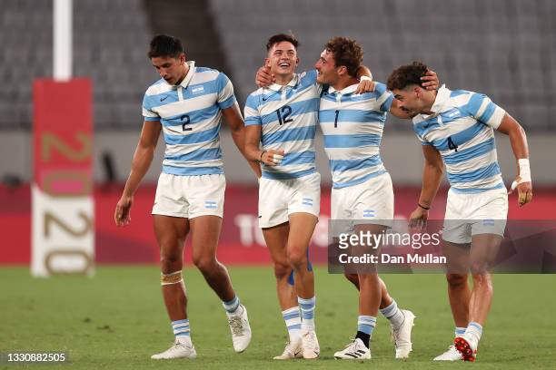 Lucio Cinti, Marcos Moneta, Rodrigo Isgro and Ignacio Mendy celebrate after their victory during the Rugby Sevens Men's Quarter-final match between...
