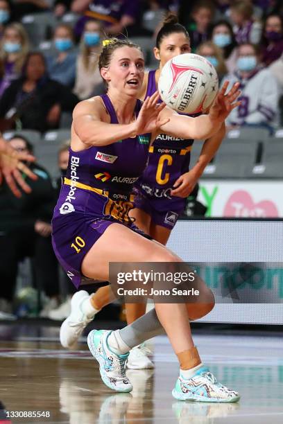 Gabi Simpson of the Firebirds passes the ball during the round 12 Super Netball match between West Coast Fever and Queensland Firebirds at Nissan...