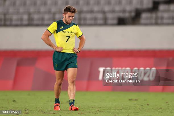 Josh Turner of Team Australia looks dejected after his team's defeat during the Rugby Sevens Men's Quarter-final match between Australia and Fiji on...