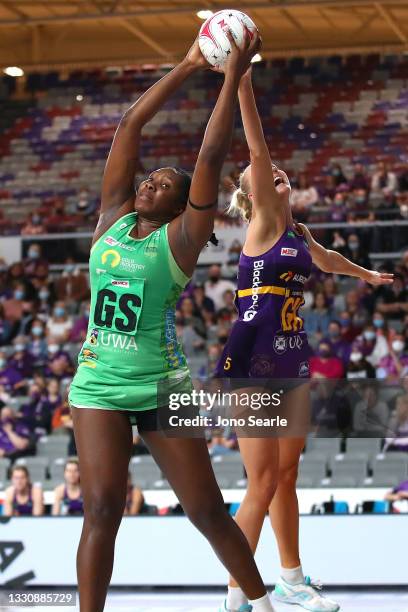 Jhaniele Fowler of the Fever competes with Rudi Ellis of the Firebirds during the round 12 Super Netball match between West Coast Fever and...