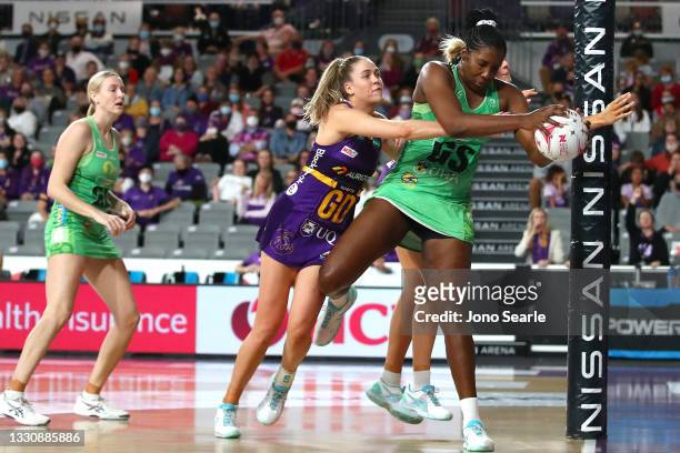 Kim Jenner of the Firebirds competes with Jhaniele Fowler of the Fever during the round 12 Super Netball match between West Coast Fever and...