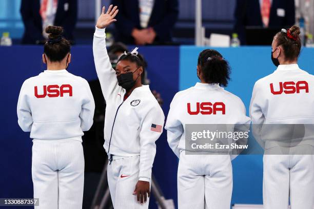Simone Biles of Team USA waves to the crowd during introductions prior to the Women's Team Final on day four of the Tokyo 2020 Olympic Games at...