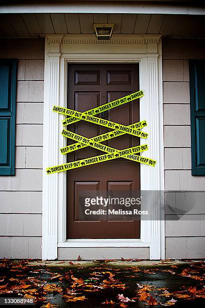 front door with caution tape - restricted area sign stock pictures, royalty-free photos & images
