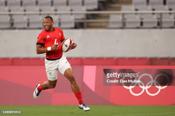 Dan Norton of Team Great Britain scores a try during the Rugby Sevens Men's Quarter-final match between Great Britain and United States on day four...