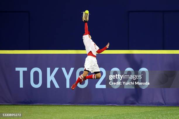 Eri Yamada of Team Japan attempts to make a catch in the first inning against Team United States during the Softball Gold Medal Game between Team...