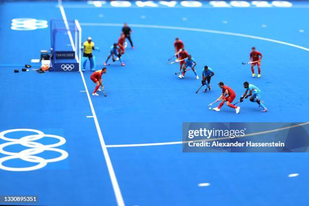 Roc Oliva Isern of Team Spain moves the ball past Rupinder Pal Singh of Team India during the Men's Preliminary Pool A match between India and Spain...