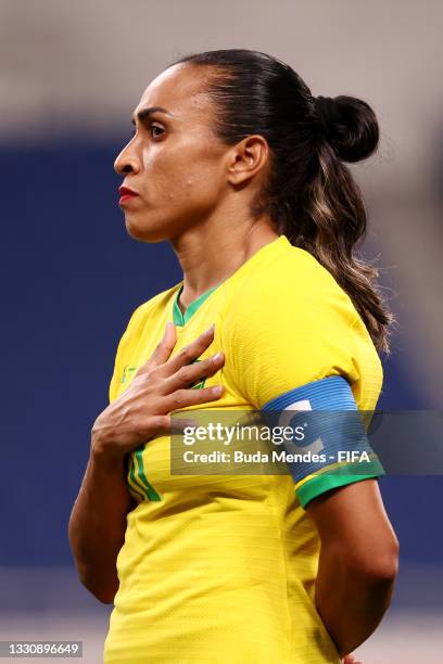 Marta of Team Brazil stands for the national anthem prior to the Women's Group F match between Brazil and Zambia on day four of the Tokyo 2020...