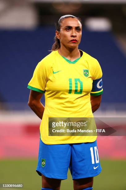 Marta of Team Brazil stands for the national anthem prior to the Women's Group F match between Brazil and Zambia on day four of the Tokyo 2020...