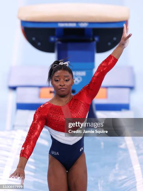 Simone Biles of Team United States reacts after stumbling on her landing while competing on vault during the Women's Team Final on day four of the...