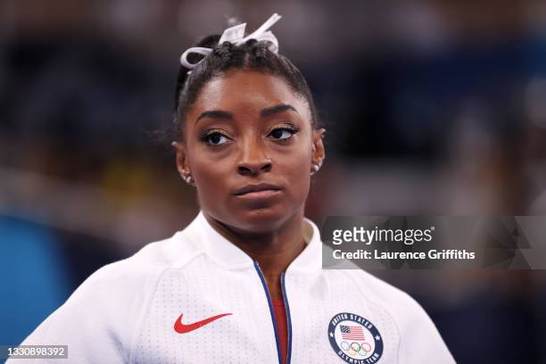 Simone Biles of Team United States looks on during the Women's Team Final on day four of the Tokyo 2020 Olympic Games at Ariake Gymnastics Centre on...