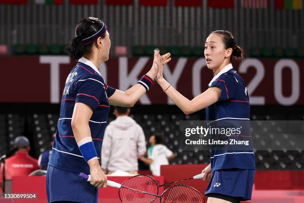 Lee Sohee and Shin Seungchan of Team South Korea react as they compete against Du Yue and Li Yin Hui of Team China during a Women's Doubles Group B...