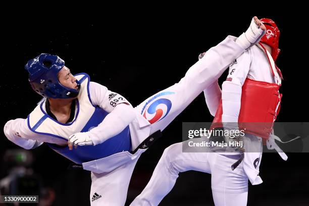 In Kyo-don of Team South Korea competes against Ivan Konrad Trajkovic of Team Slovenia during the Men's +80kg Taekwondo Bronze Medal contest on day...