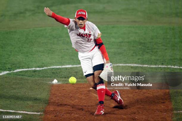 Yukiko Ueno of Team Japan pitches in the third inning against Team United States during the Softball Gold Medal Game between Team Japan and Team...